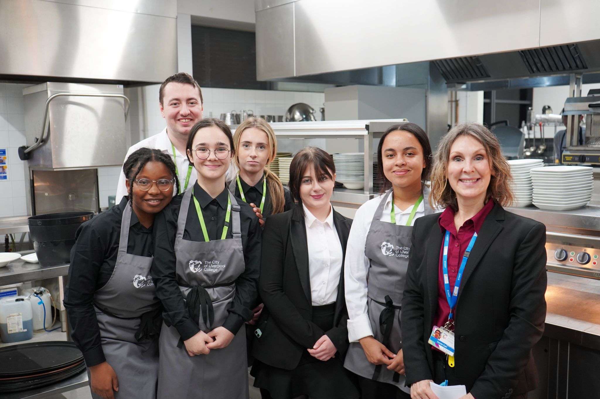 Students and tutors in Academy restaurant kitchen